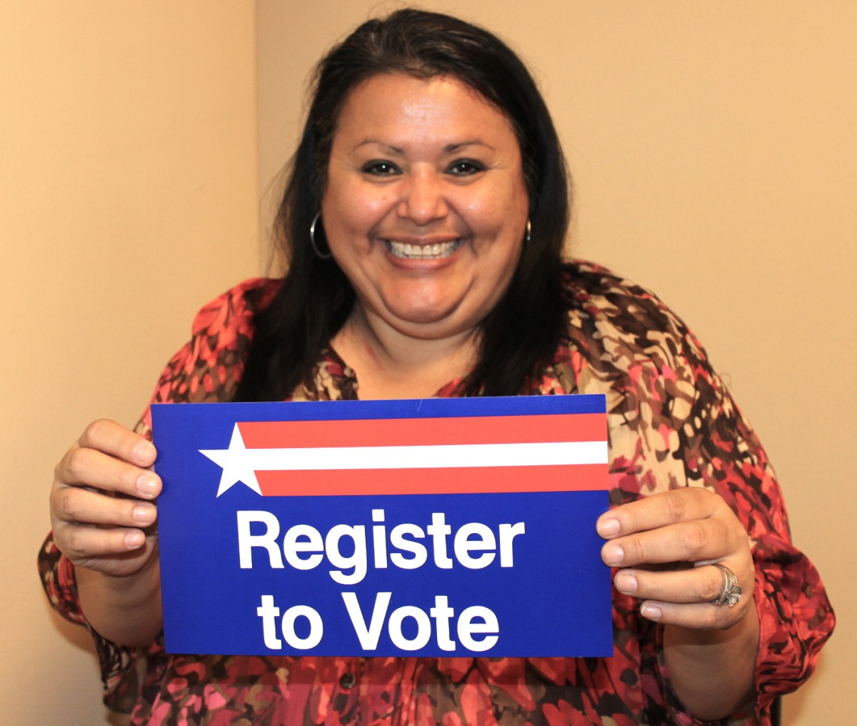 Imelda votes to set a good example for her kids, and to honor the women and people of color who fought for her right to vote. Photo by Denise Miller.